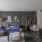 a living room with a couch and chairs