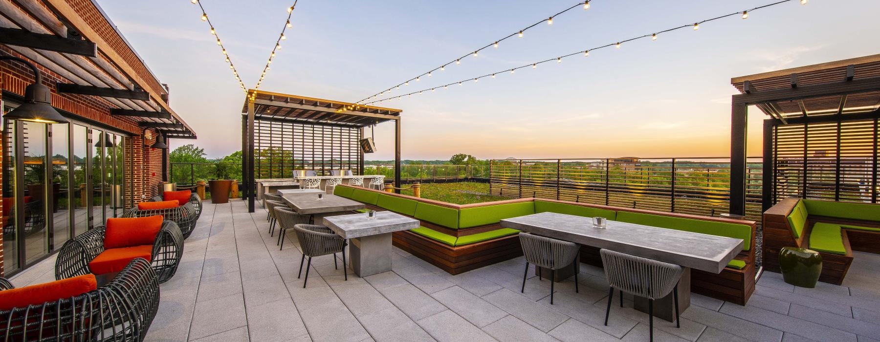 a patio with tables and chairs