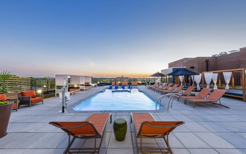 a large pool with chairs around it