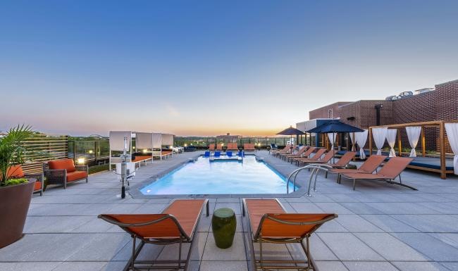a large pool with chairs around it